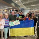 People holding Ukrainian flag